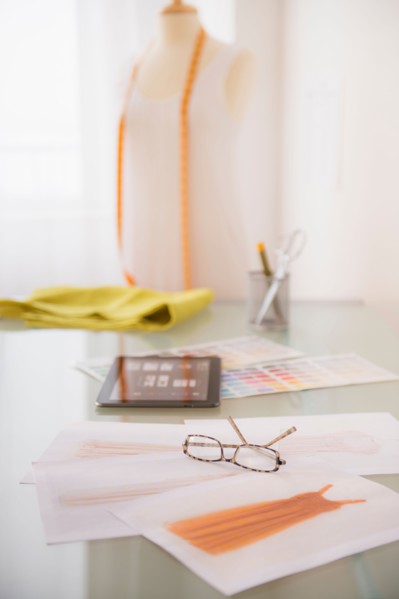 View of digital tablet, sketch and spectacles
