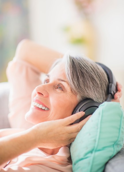 Portrait of woman listening to music