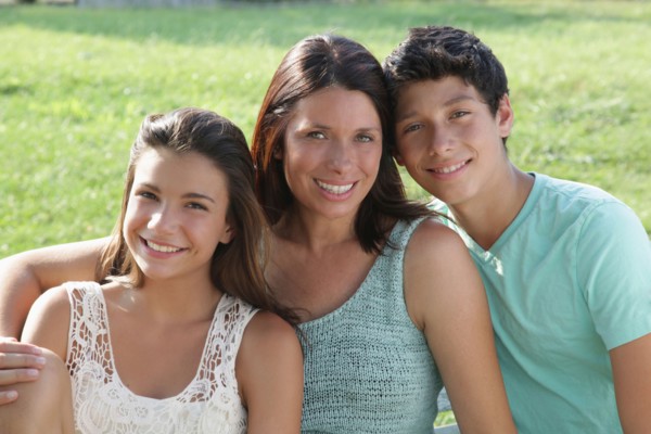 Portrait of mother with daughter (12-13) and son (14-15)
