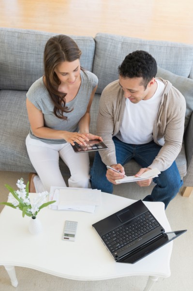 Young couple doing home finances.