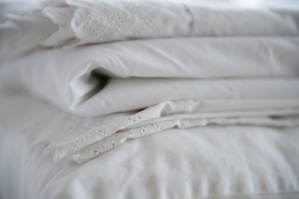 Close up of folded white sheets, studio shot