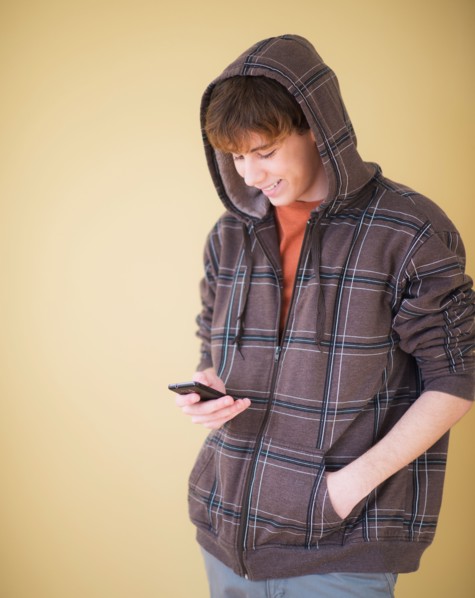 Teenage boy (14-15) text messaging