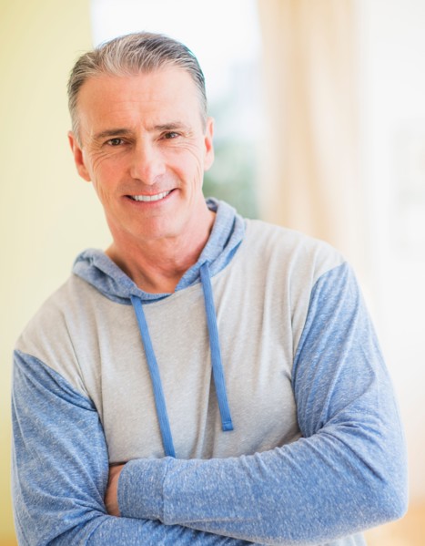 Portrait of man with arms crossed