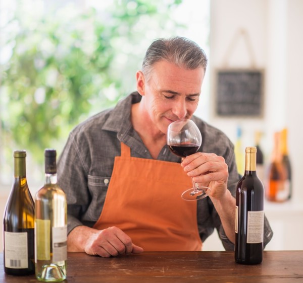 Portrait of man tasting wine