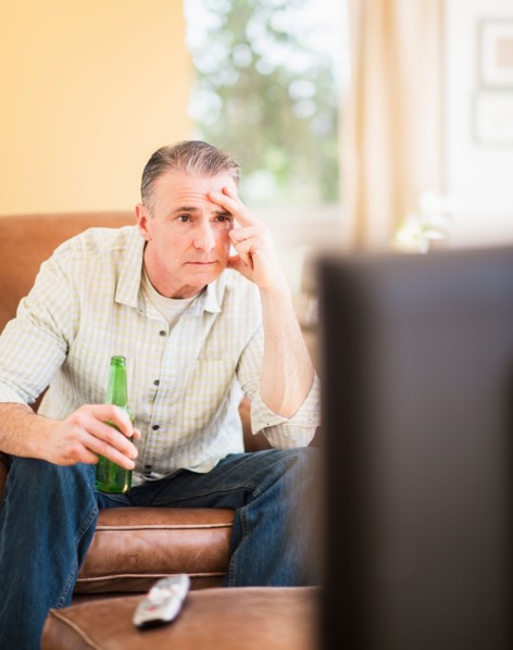 Portrait of man watching tv