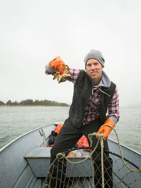 Portrait of man showing crab