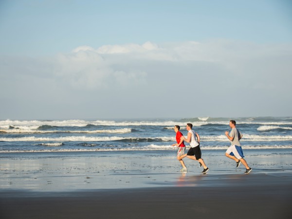 Men running on beach