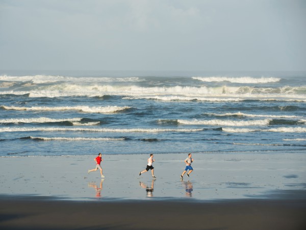 Men running on beach
