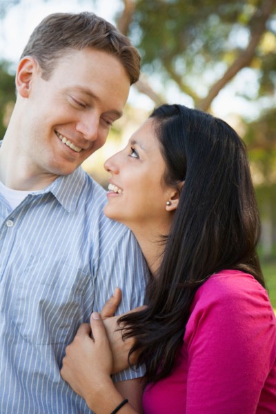 Couple embracing in park