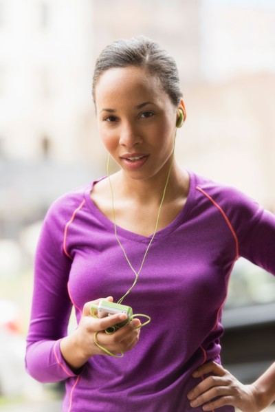 Portrait of female jogger with mp3 player.