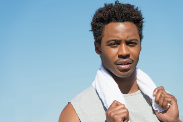 Athlete with towel on neck.