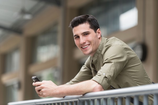 Man text messaging.