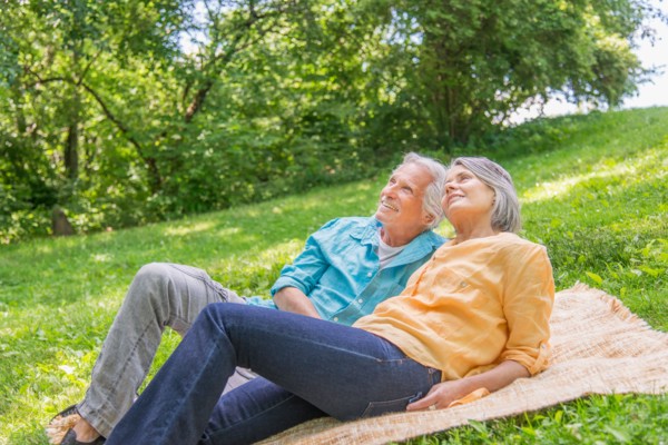 Central Park, New York City. Senior couple relaxing in park.