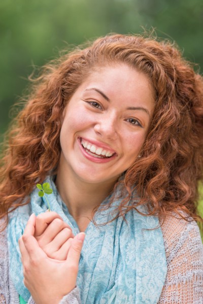 Portrait of young woman in park.