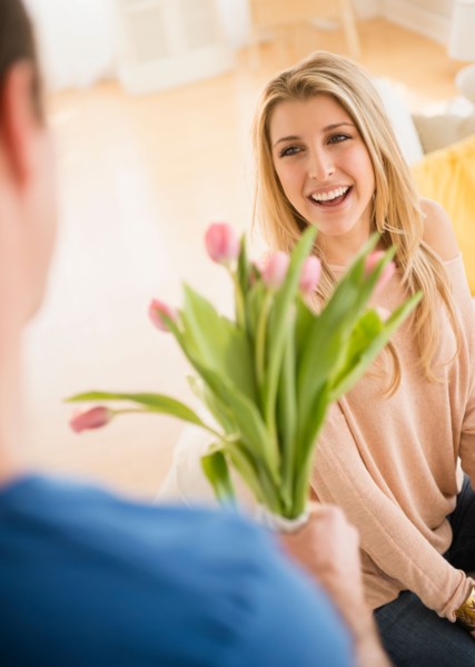 Man giving his girl flowers