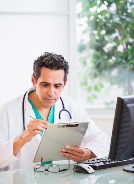 Portrait of doctor working in office