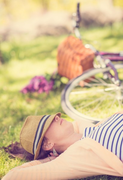 Portrait of mid adult woman relaxing in park