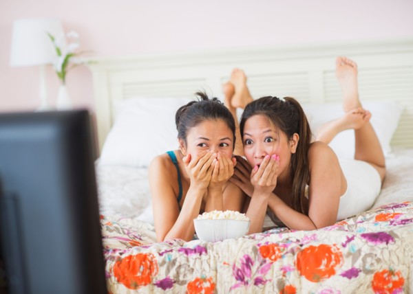 Two women watching tv