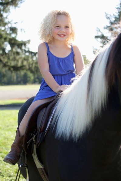 Girl (4-5) horseriding