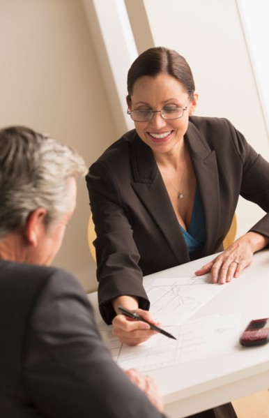 Mature woman working with mature man
