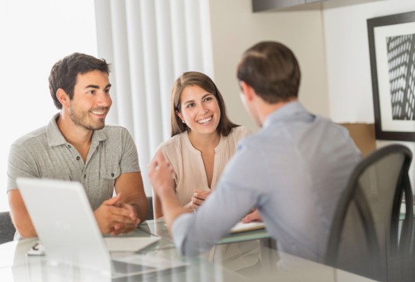 Customers talking to advisor in office.