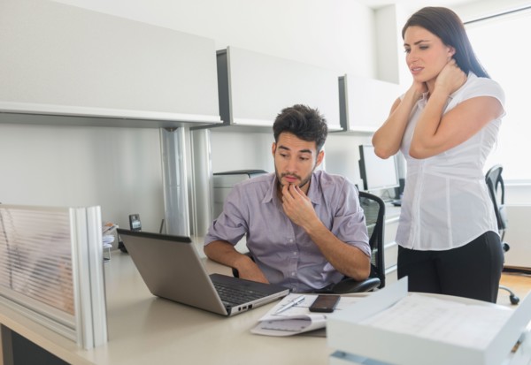 Business man and woman at work in office.