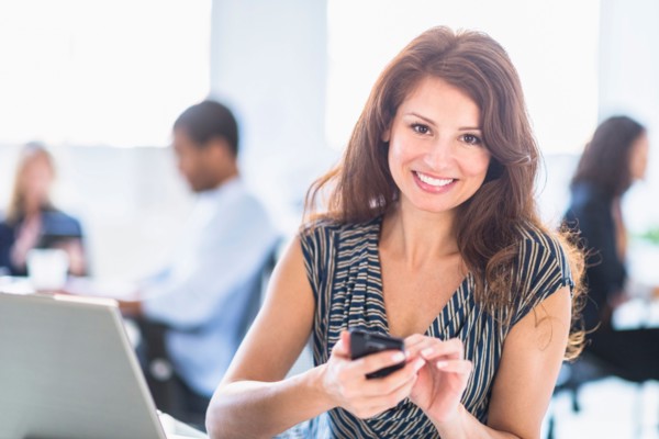 Smiling woman in office.