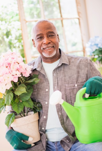 Portrait of man working in greenhouse