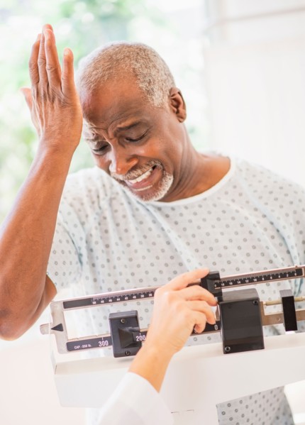 Upset man on weight scale