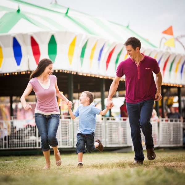 Happy Family and son (4-5) in amusement park