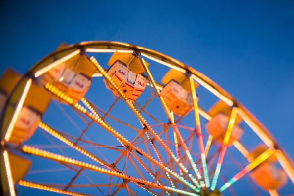 Ferris wheel in amusement park at dusk