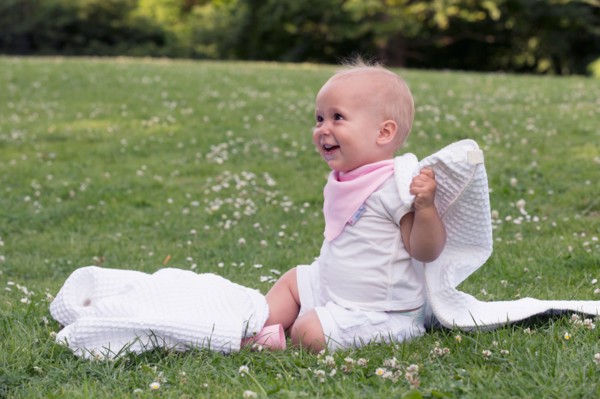 Baby (12-17 months) playing in park
