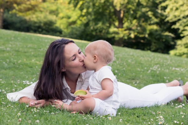 Mother and daughter (12-17 months) playing in park