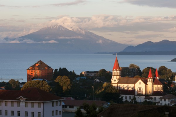 Town skyline with volcano in background