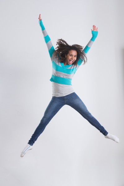 Studio Shot of girl (12-13) jumping