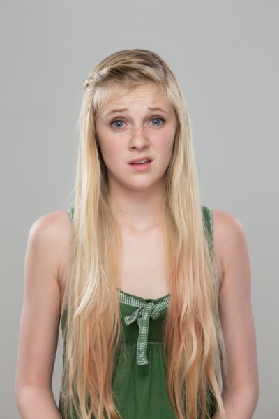 Portrait of teenage girl (14-15) making a face