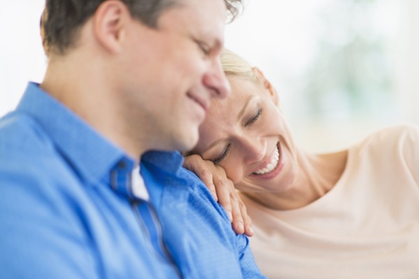 Couple relaxing, focus on woman.