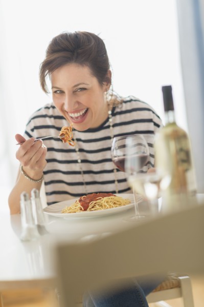 Woman eating spaghetti.