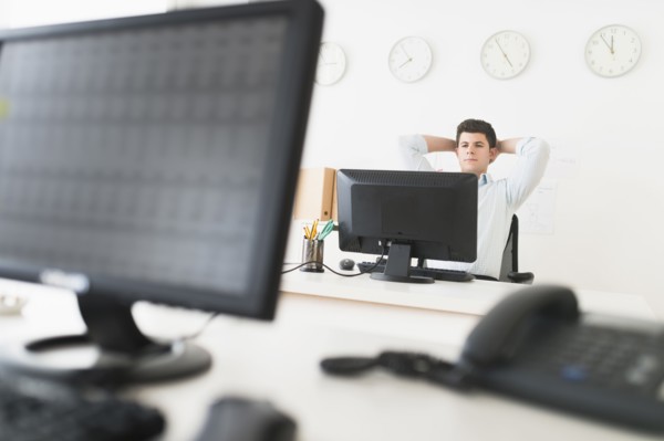 Young man sitting in front of desk and working.