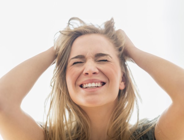 Frustrated woman pulling hair.