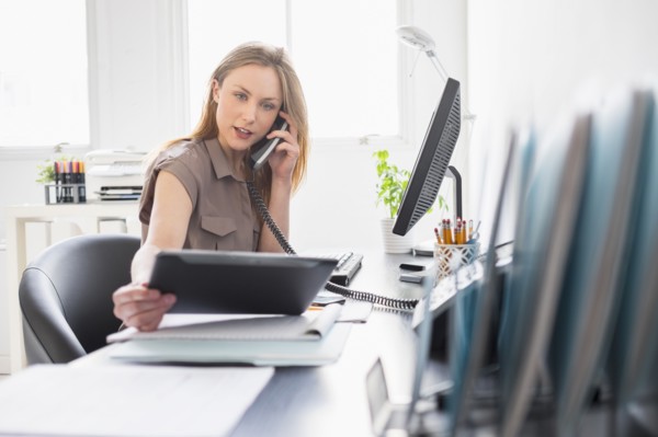 Portrait of young woman working in office.
