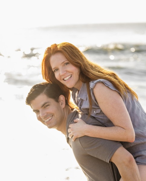 Portrait of couple on beach.