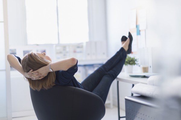 Business woman relaxing in office.