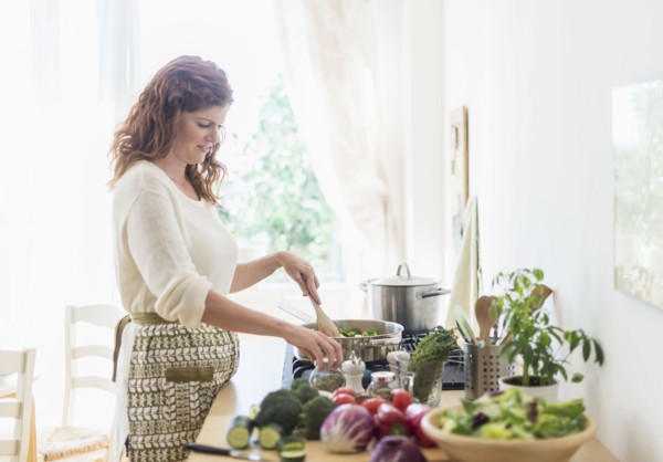 Woman cooking in kitchen.