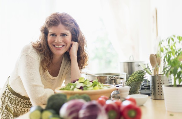 Woman cooking in kitchen.