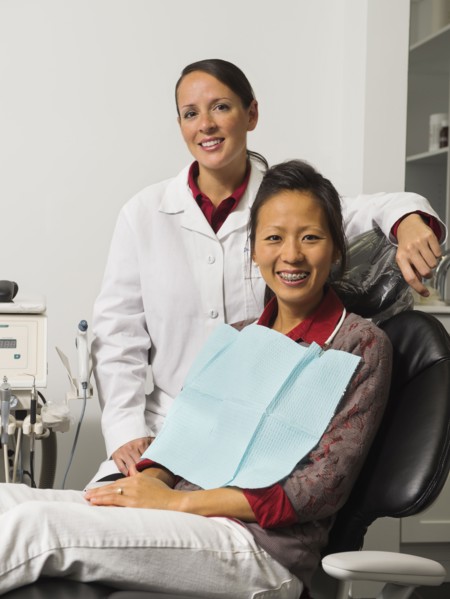 Portrait of dentist with patient.