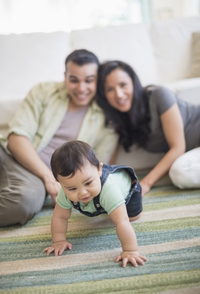 Family with baby son (6-11 months) in living room.