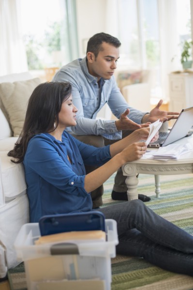 Couple working in living room.