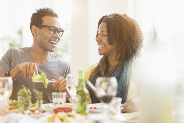 Two friends enjoying dinner party.