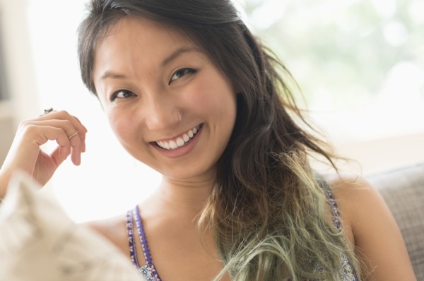 Portrait of young woman smiling.